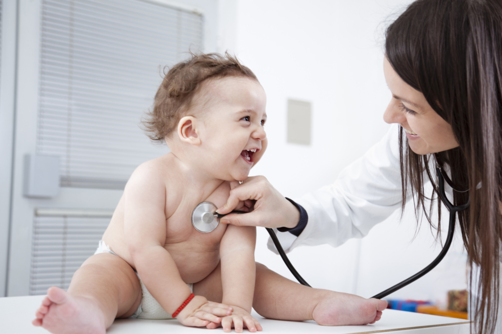 Living Well Family Medicine of Boerne Doctor checking up baby with stethoscope.