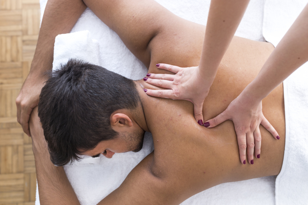 living well boerne family medicine Young man is enjoying massage on spa treatment